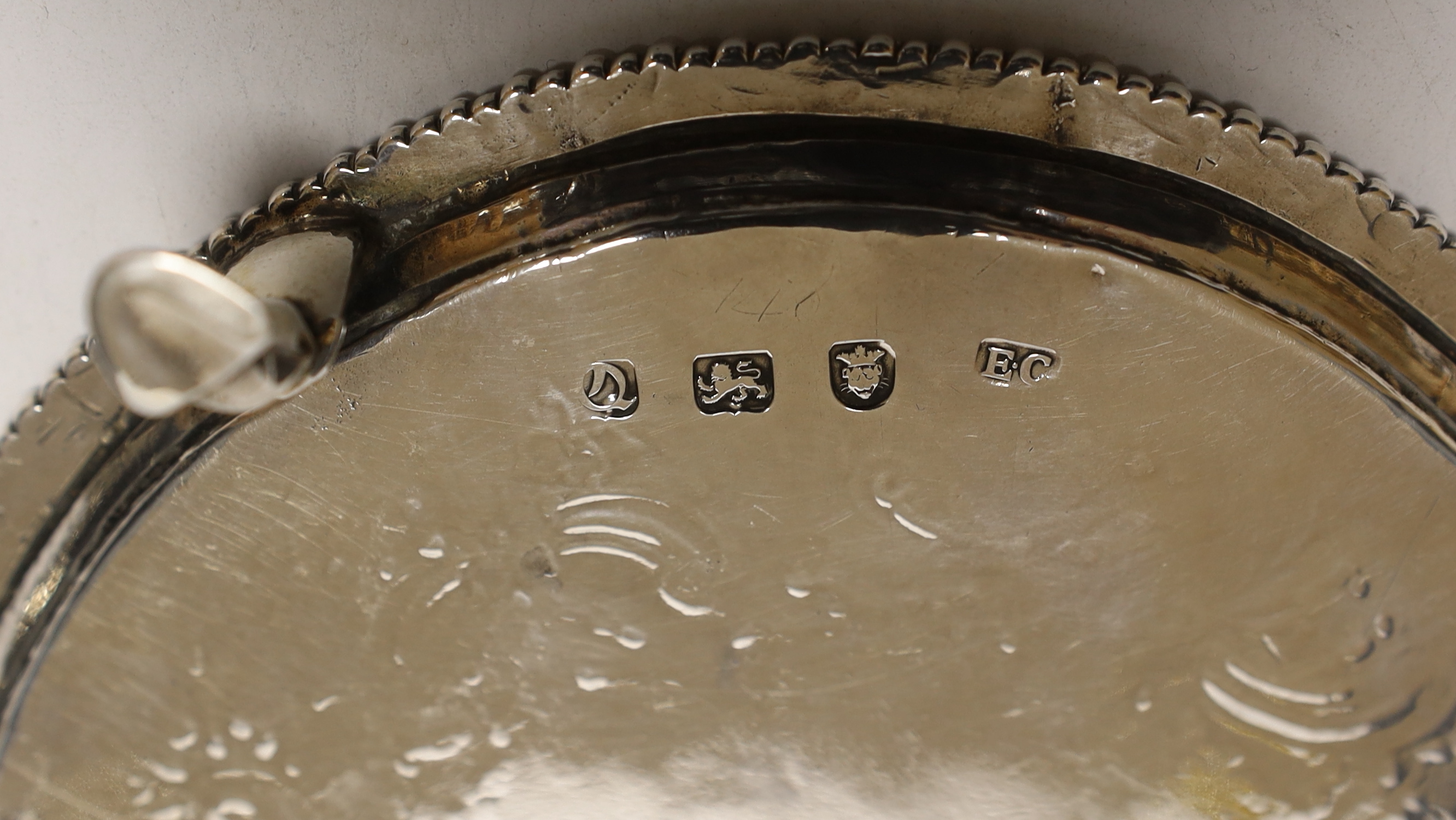 A George III silver waiter by Ebenezer Coker, London, 1771, with later engraved decoration, 15.2cm, 6.4oz.